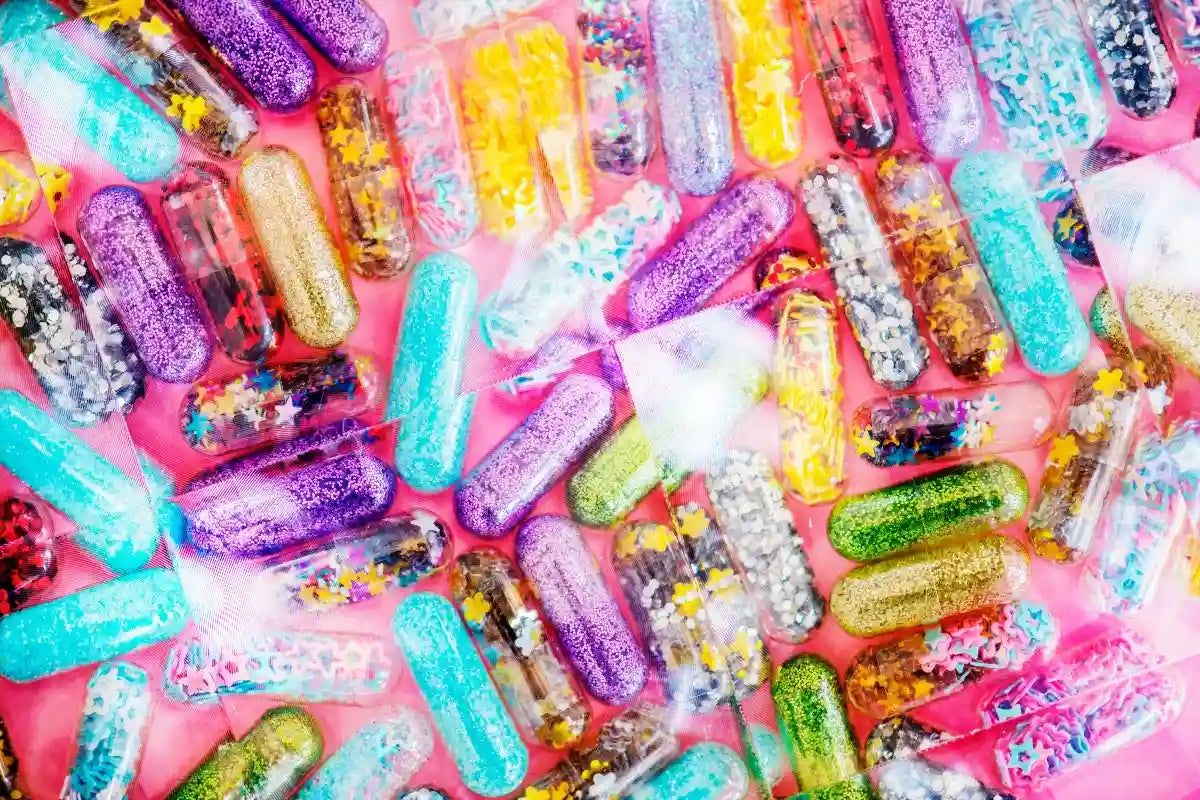 Colorful rave glitter capsules.
